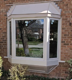 New beige bay window with original roof and new skirt